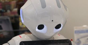 Humanoid Robot "Pepper" is displayed at SoftBank Mobile shop in Tokyo, Friday, June 6, 2014. The 121 centimeter (48 inch) tall, 28 kilogram (62 pound) white Pepper, which has no hair but two large doll-like eyes and a flat-panel display stuck on its chest, was developed jointly with Aldebaran Robotics, which produces autonomous humanoid robots. (AP Photo/Koji Sasahara)